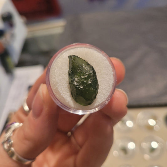 Moldavite in triangle case